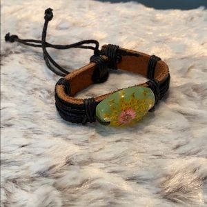 Leather tie bracelet with glass flower